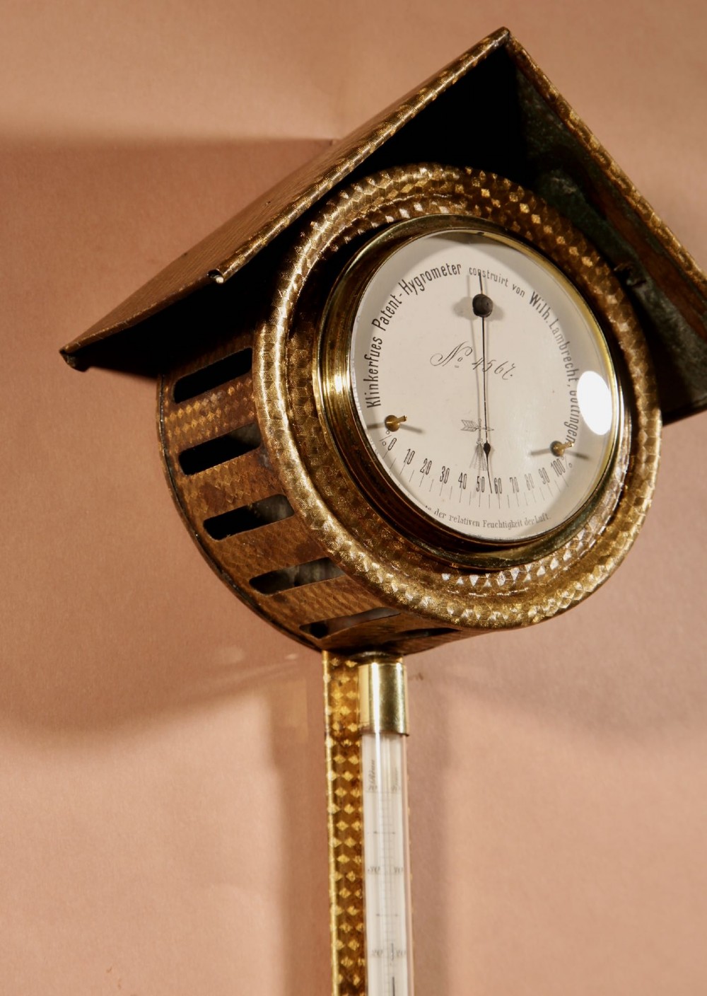 An antique late nineteenth-century brass wall-mounted Klinkerfues patent hair hygrometer weather station featuring two circular dials and a central thermometer tube. View IX