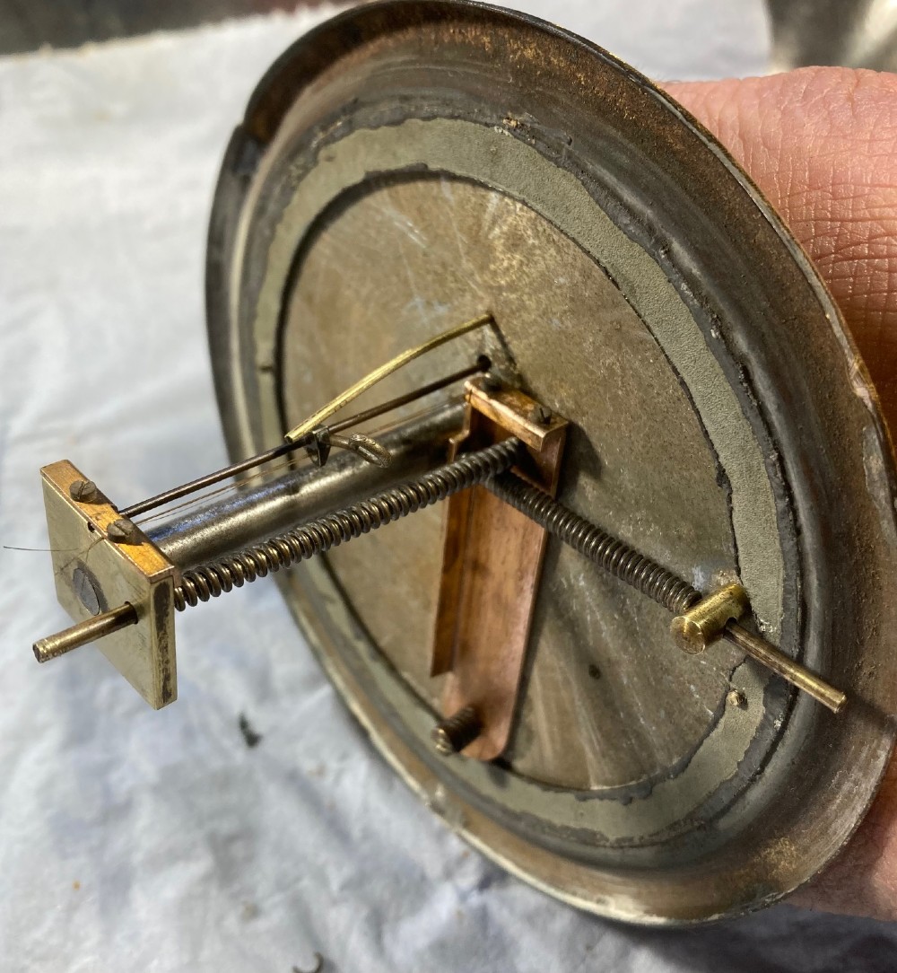 An antique late nineteenth-century brass wall-mounted Klinkerfues patent hair hygrometer weather station featuring two circular dials and a central thermometer tube. View XI
