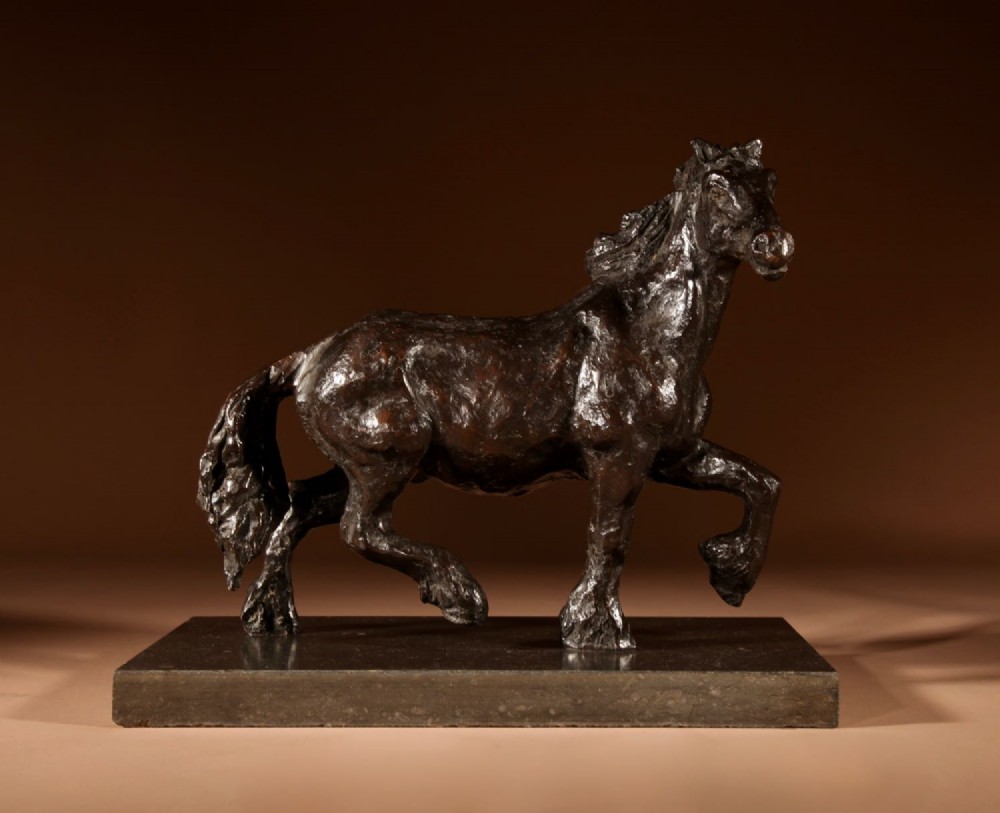 A dark patinated bronze sculpture of a muscular draft horse with one raised foreleg mounted on a rectangular stone base. View II