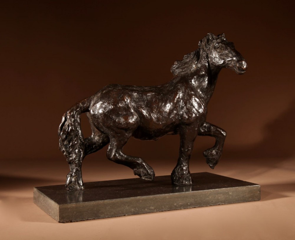 A dark patinated bronze sculpture of a muscular draft horse with one raised foreleg mounted on a rectangular stone base. View III