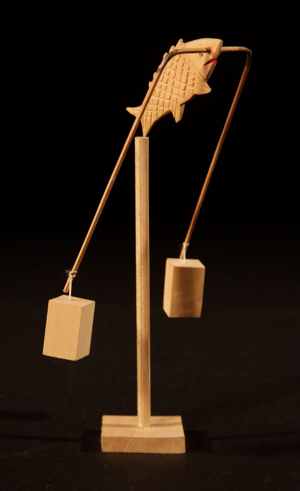 A collection of nine hand-carved light wood miniatures depicting various traditional Chinese daily life trades, vehicles, and activities. View III