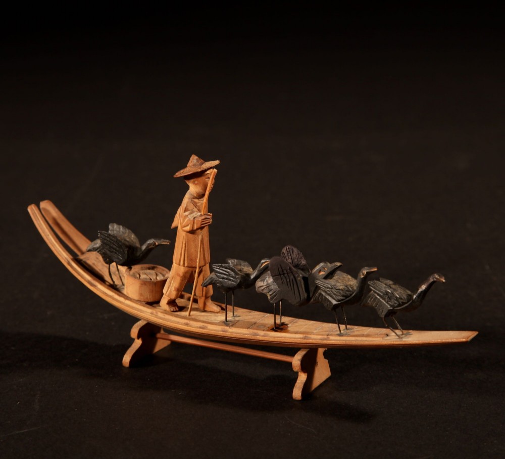 A collection of seven light-coloured Chinese wood carvings depicting figures engaged in traditional daily activities including weaving, fishing, and carrying a sedan chair. View II