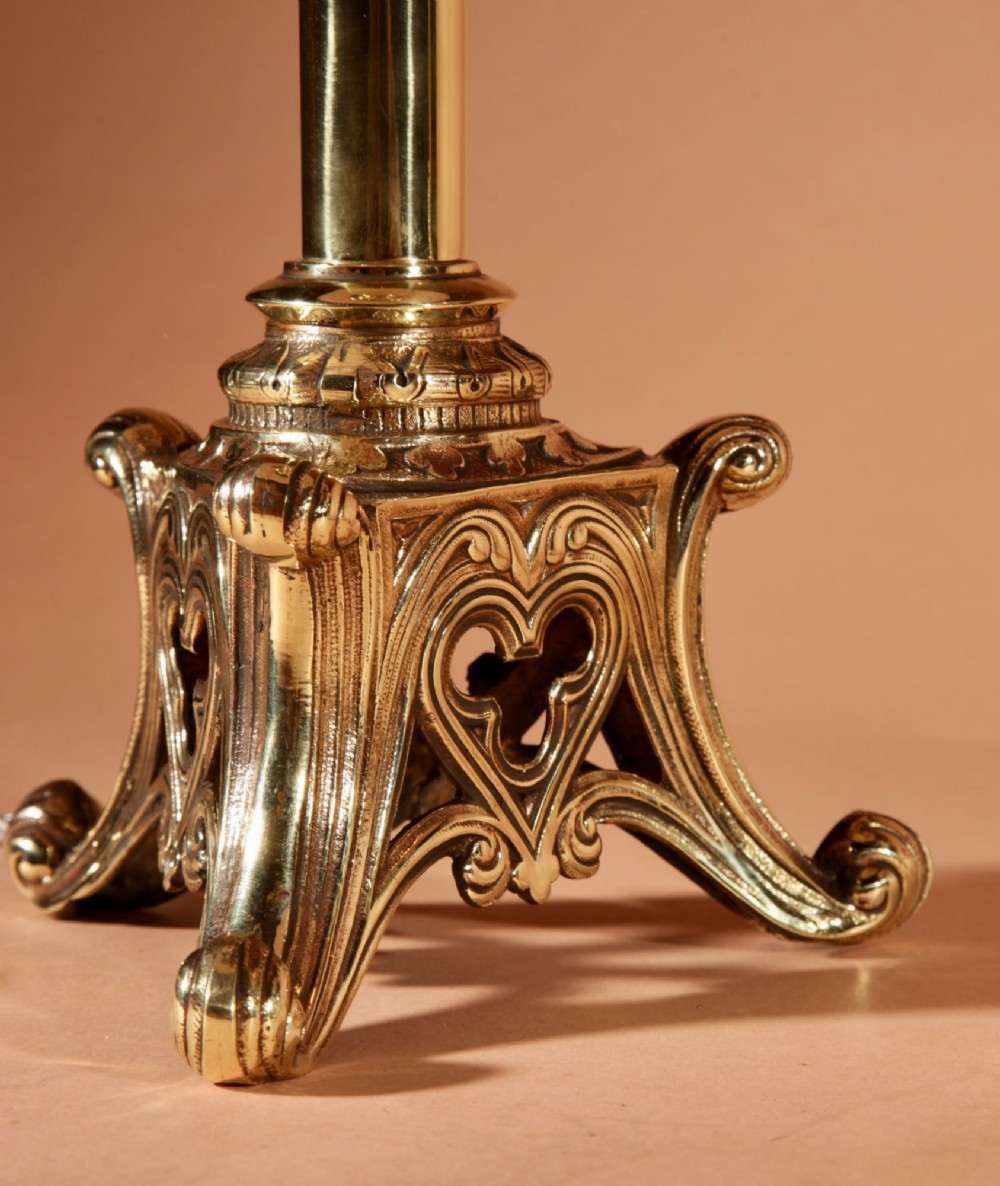 A pair of tall cast brass table lamps featuring Gothic architectural bases and pleated cream shades. View III