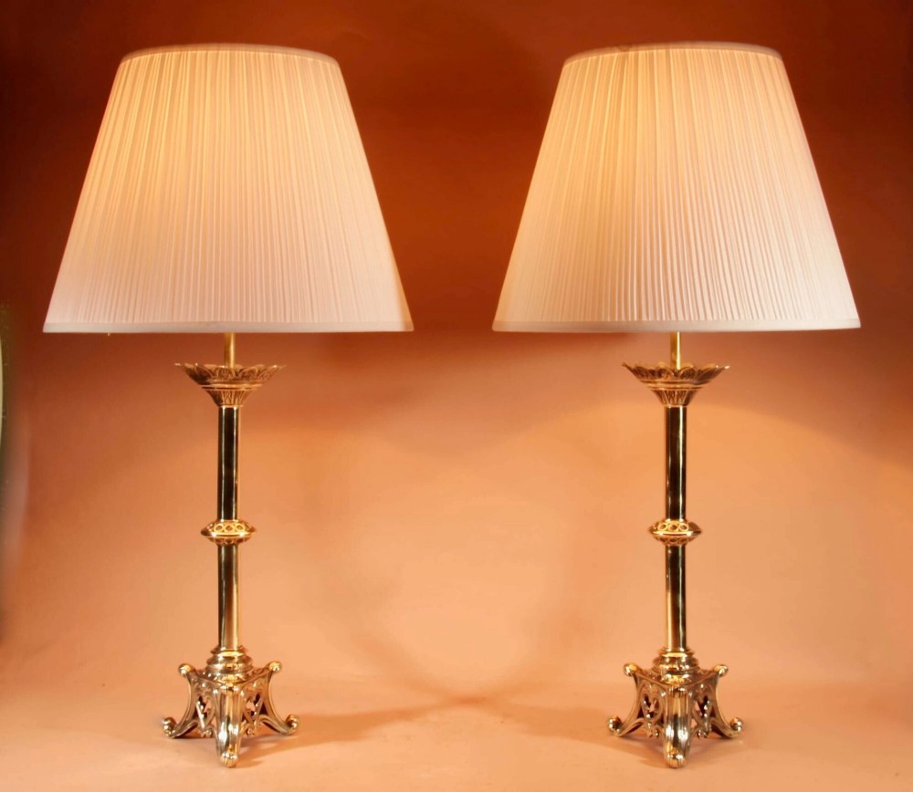 A pair of cast brass table lamps featuring Gothic Revival columnar shafts and pleated neutral shades. View II
