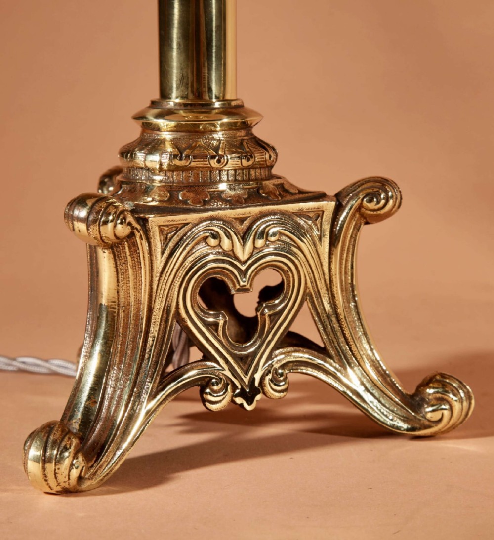 A pair of cast brass table lamps featuring Gothic Revival columnar shafts and pleated neutral shades. View IV