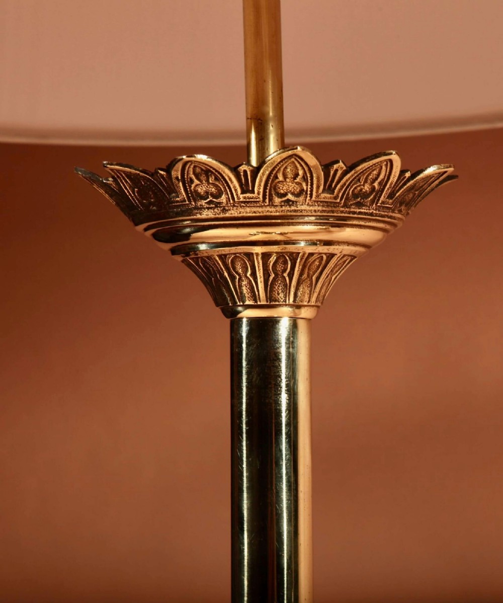 A pair of cast brass table lamps featuring Gothic Revival columnar shafts and pleated neutral shades. View VI
