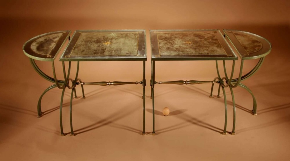 A four-part French Art Deco coffee table constructed from green wrought iron and brass with mirrored glass inserts featuring star motifs. View II