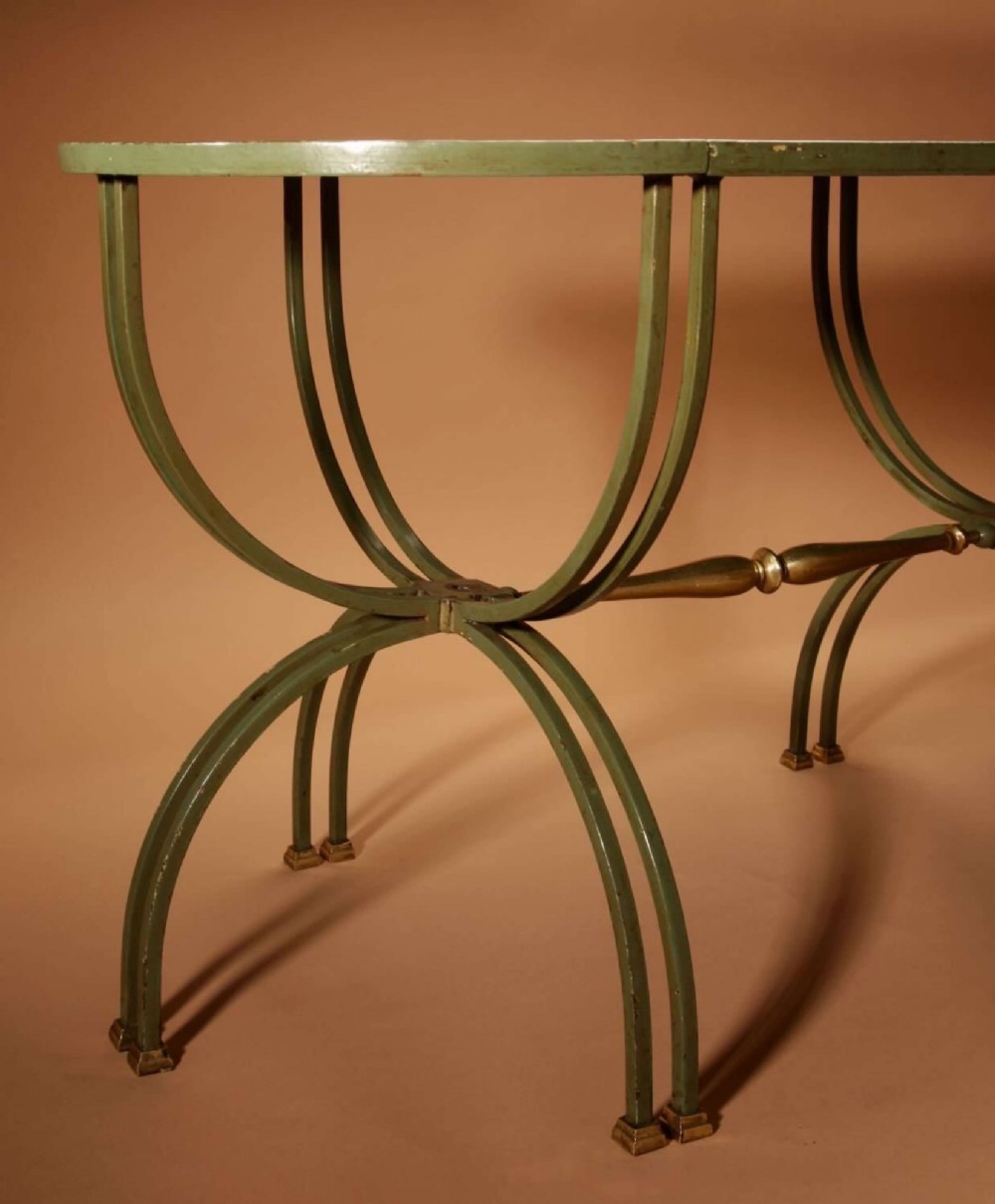 A four-part French Art Deco coffee table constructed from green wrought iron and brass with mirrored glass inserts featuring star motifs. View III