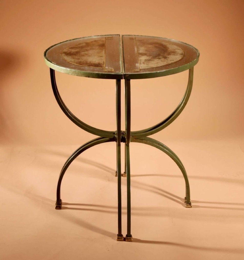 A four-part French Art Deco coffee table constructed from green wrought iron and brass with mirrored glass inserts featuring star motifs. View XI