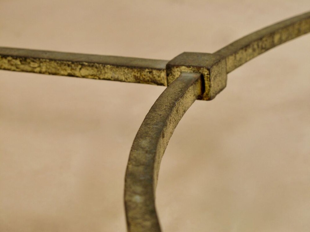 A rectangular gilded wrought iron coffee table featuring a clear glass inserted top and a curved stretcher base. View IV