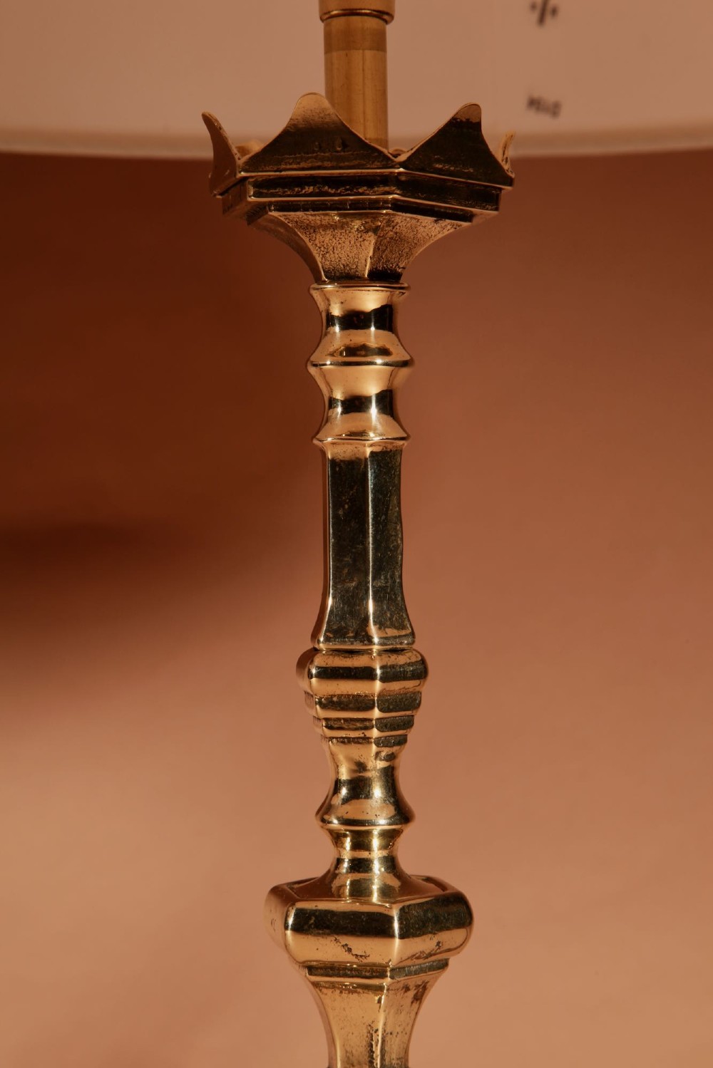 A pair of cast brass table lamps featuring turned baluster shafts, scroll-footed bases, and pleated cream fabric shades. View III