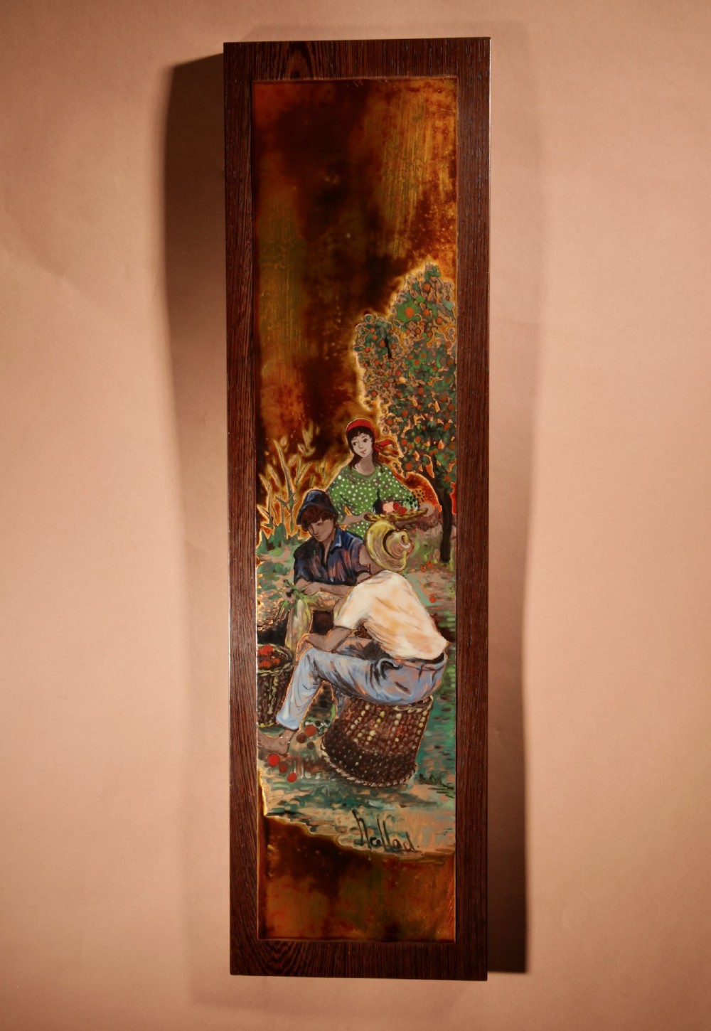 A vertical rectangular framed enamel on copper painting depicting three figures harvesting fruit in an orchard setting.