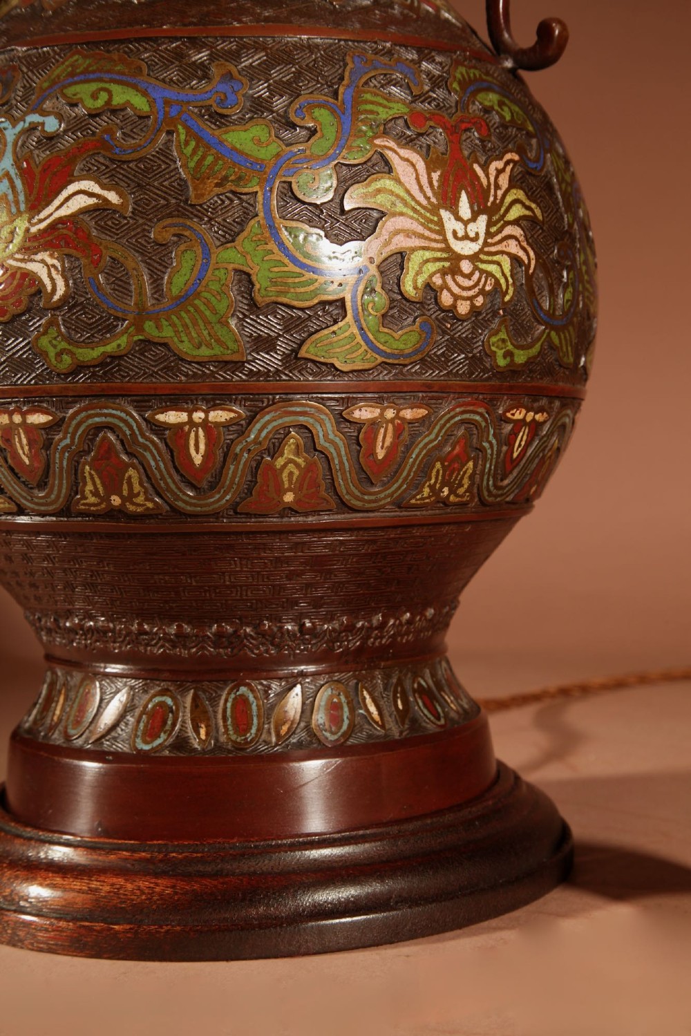 A Japanese champleve bronze vase lamp with ornate scroll handles and polychrome enamel detailing, topped with a pleated white shade. View III