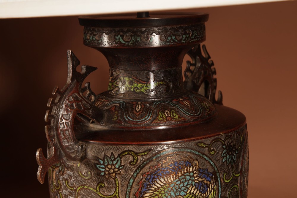 A Japanese champleve bronze vase base featuring cast dragon handles and polychrome enamel roundels, topped with a cream pleated shade. View VII