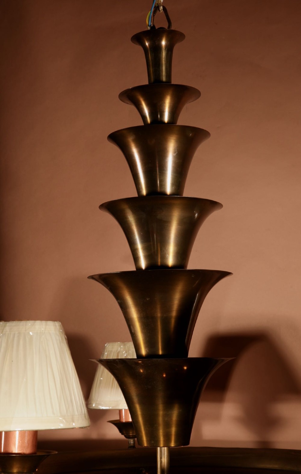 An Amsterdam School bronze five-light chandelier featuring a tiered central column and small pleated lampshades. View VIII