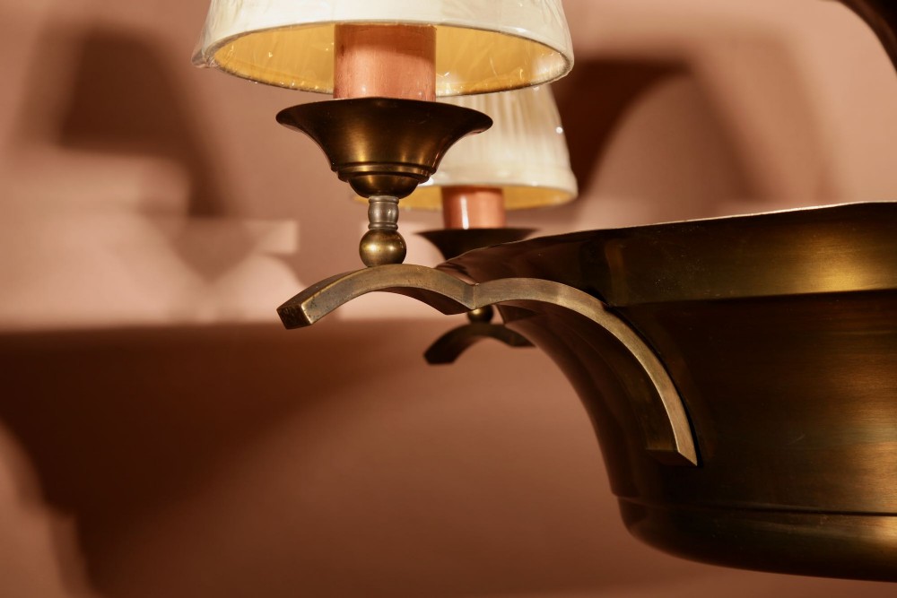 An Amsterdam School bronze five-light chandelier featuring a tiered central column and small pleated lampshades. View XI