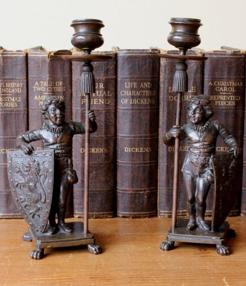 19th Century Bronze Candlesticks Decorated with Whimsical Knights and Lion Shields.