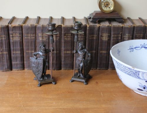 fig 1. 19th Century Bronze Candlesticks Decorated With Whimsical Knights and Lion Shields.