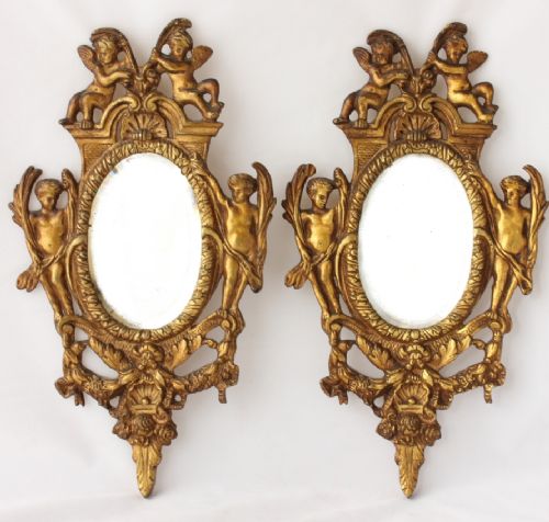 Pair of Small Oval 19th Century French Gilt Brass Cherub Wall Mirrors