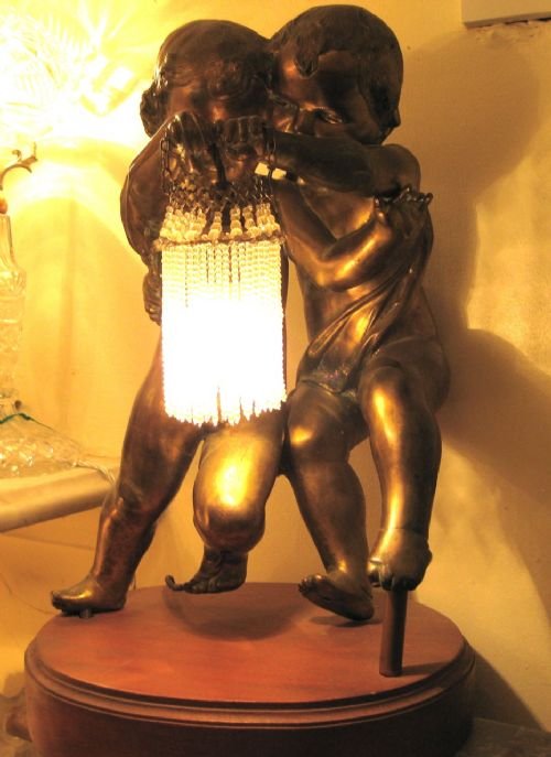 Gilded Spelter Cherub Lamp Holding Original Beaded Lampshade.