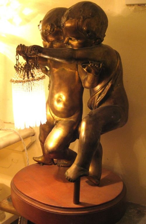 fig 1. Gilded Spelter Cherub Lamp Holding original beaded lampshade.