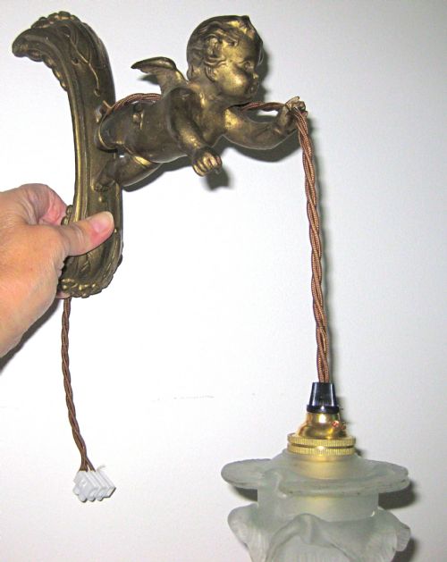 A Gilded Brass Cherub Wall Light