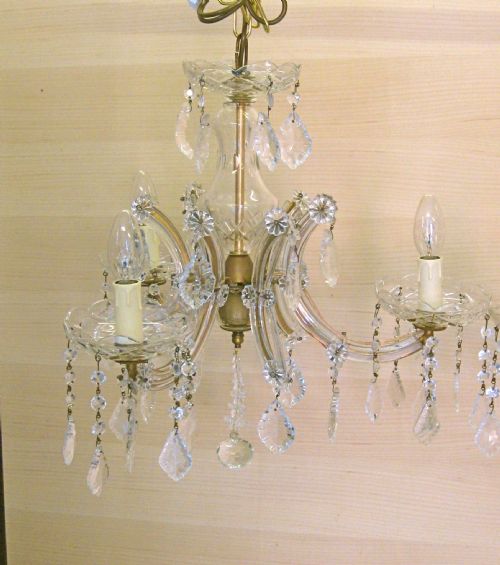 fig 1. A PAIR OF THREE ARM MARIE THERESE CHANDELIERS