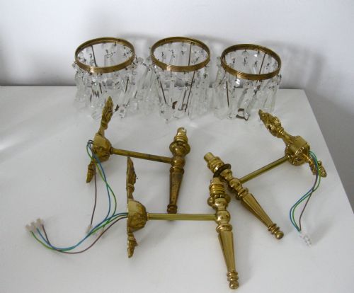 fig 1. A SET OF THREE BRASS WALL LIGHTS WITH CRYSTAL DROP SHADES