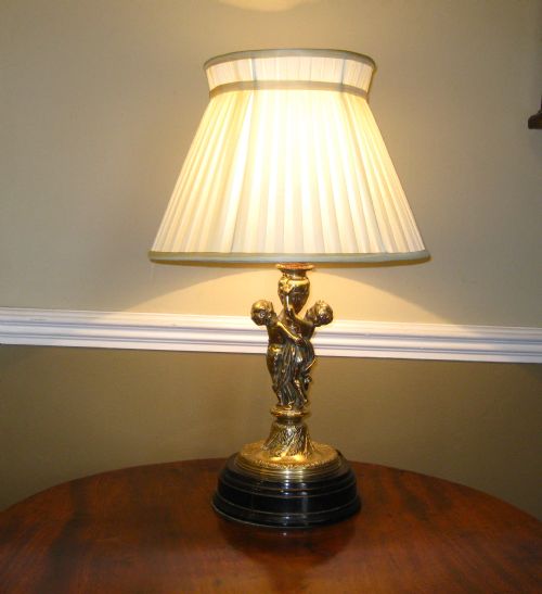 A Victorian Gilded Cherub Lamp