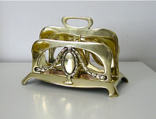 An Art Nouveau Brass and Copper Letter Rack