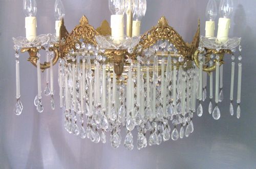 fig 1. A BRASS CHANDELIER WITH LONG FROSTED GLASS DROPS