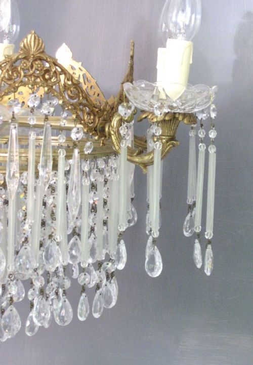 fig 2. A BRASS CHANDELIER WITH LONG FROSTED GLASS DROPS