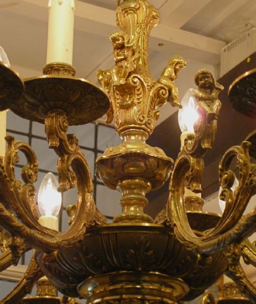 fig 1. A BRASS CHANDELIER WITH CHERUBS