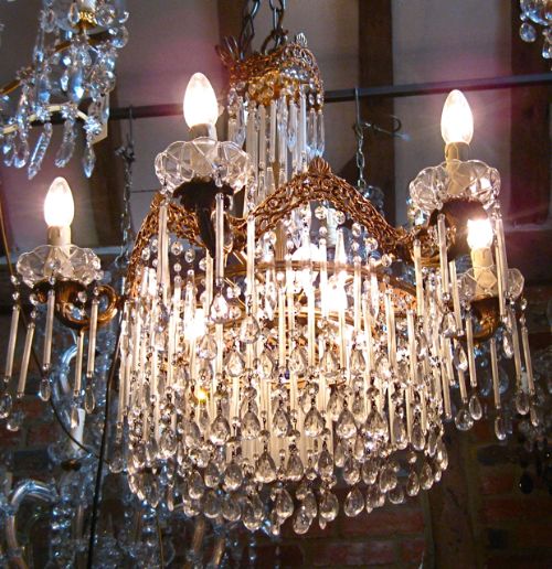 fig 3. A BRASS CHANDELIER WITH LONG FROSTED GLASS DROPS