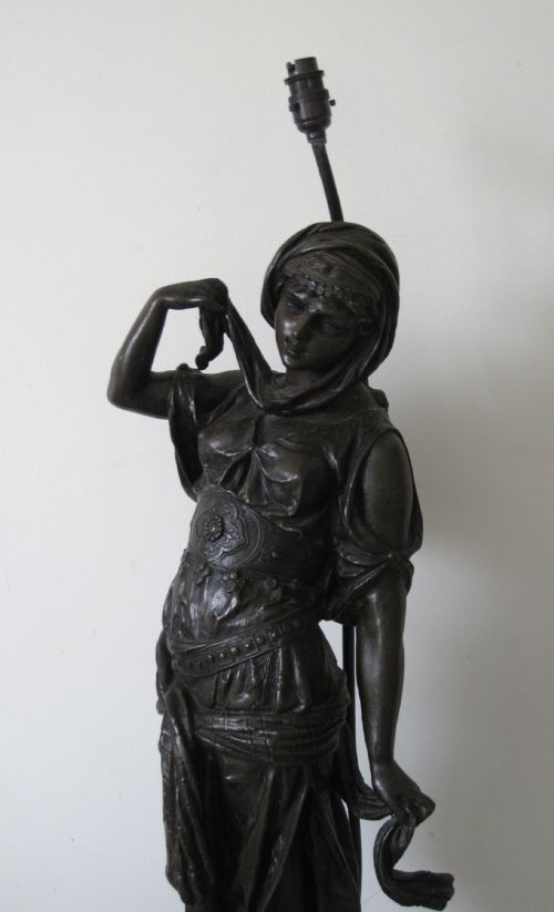 A Very Tall Antique Spelter Lamp
