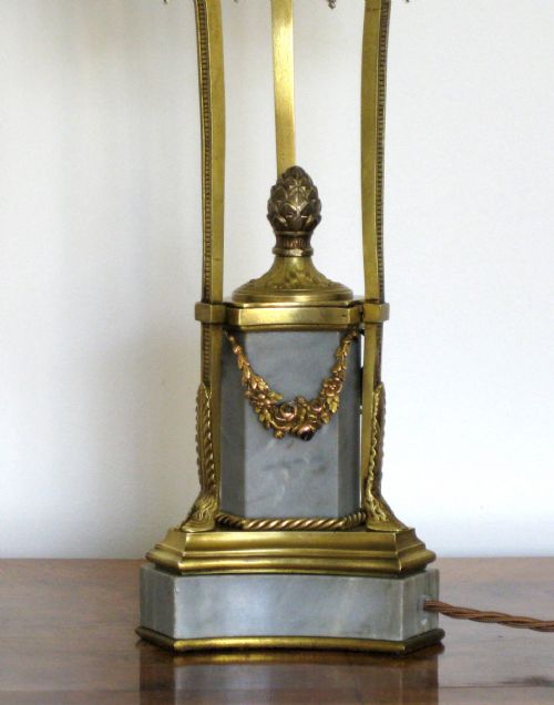 fig 1. A BRASS AND MARBLE LAMP WITH BEADED SHADE