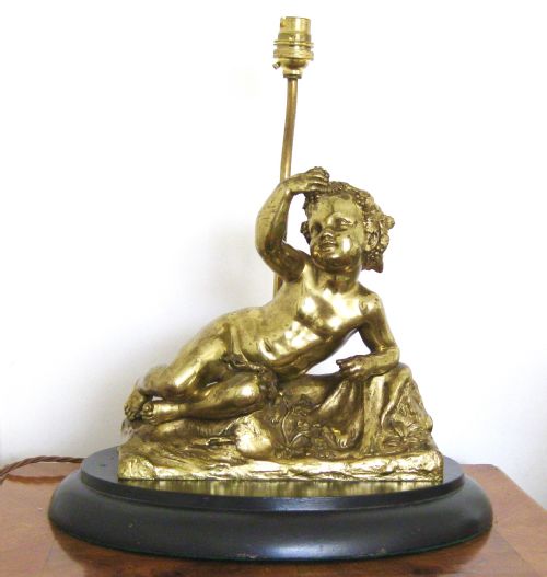 A Victorian Gilded Bronze Cherub Lamp