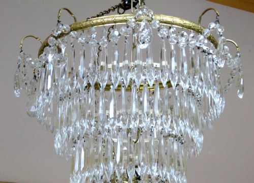 fig 1. A FIVE TIER GLASS DROP CHANDELIER