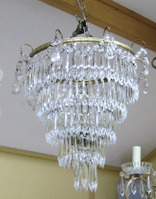 A Five Tier Glass Drop Chandelier