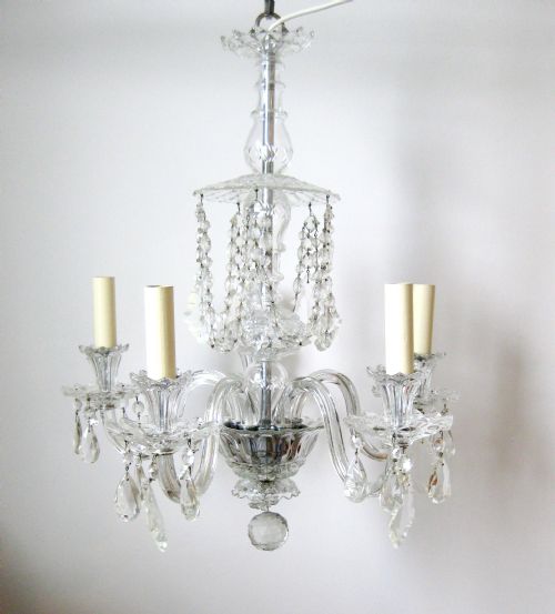fig 1. A FIVE ARM CRYSTAL CHANDELIER