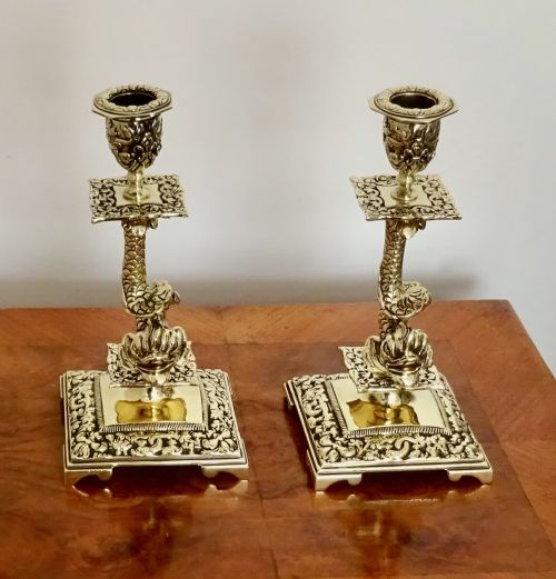 A Pair of Victorian Brass Dolphin Candlesticks