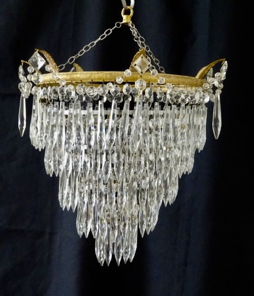 A Five Tier Glass Drop Chandelier