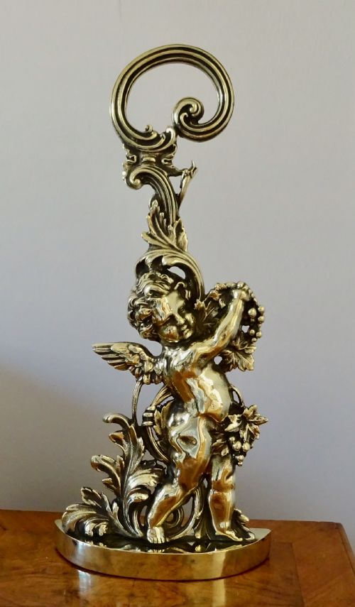 A Victorian Brass Cherub Door Stop
