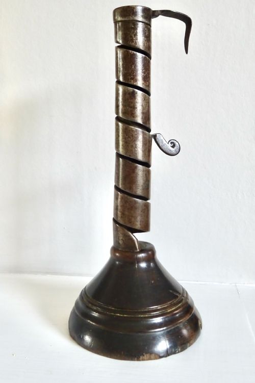 A 19th Century Iron and Wood Spiral Candlestick