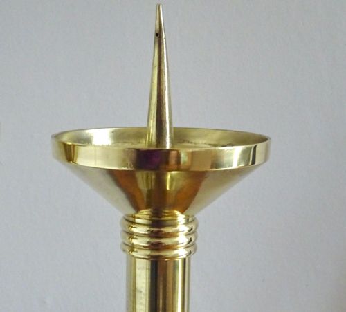 fig 1. A pair of polished late Victorian brass pricket candlesticks featuring vertical spikes, flared drip pans, embossed stem knops, and tripod feet.