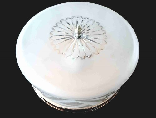 fig 1. A circular 1930s flush mount ceiling light made of frosted glass featuring etched floral details and a polished copper gallery rim.