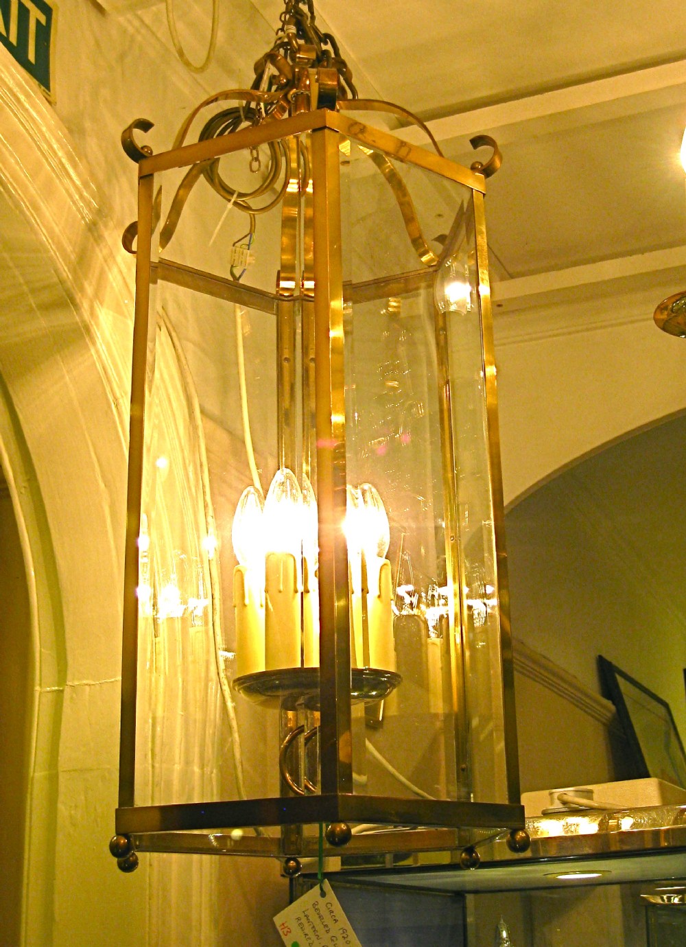 A TALL ANTIQUE BRASS HALL LANTERN