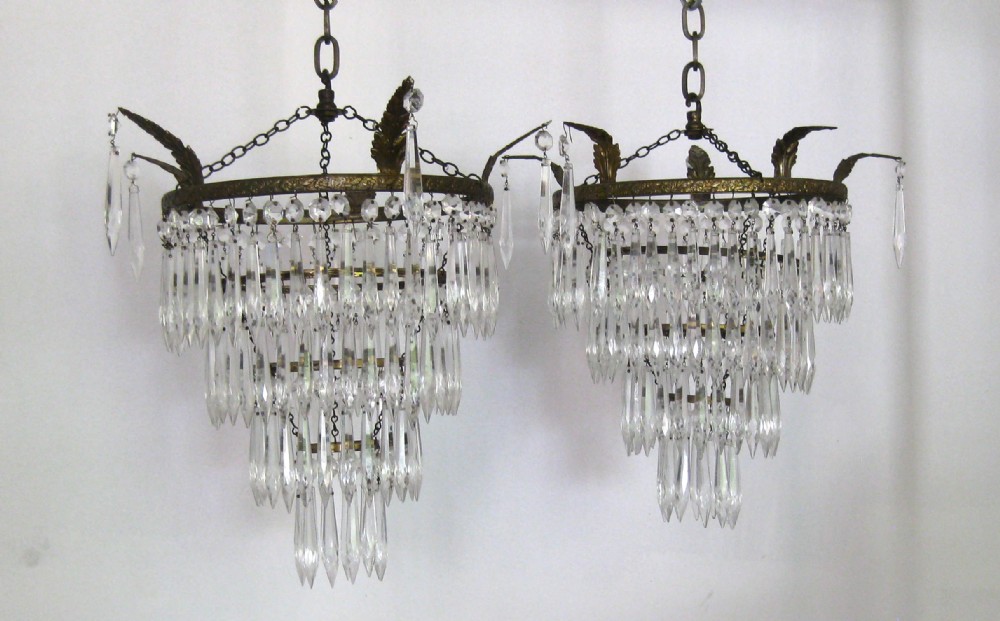 A PAIR OF ANTIQUE FOUR TIER GLASS CEILING LIGHTS