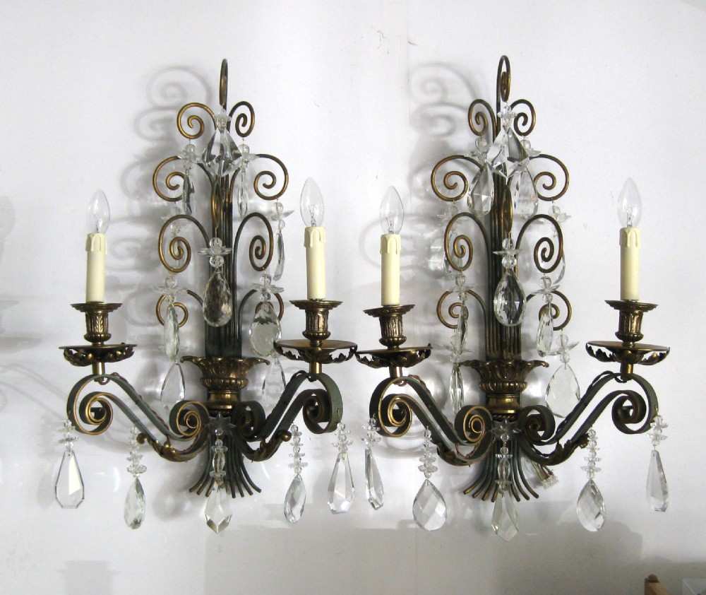 A PAIR OF PAINTED STEEL AND GILDED WALL LIGHTS
