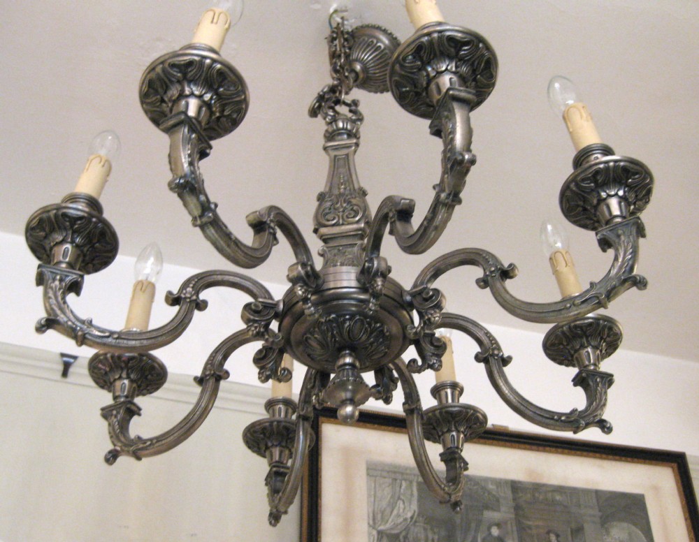 AN ANTIQUE SILVER PLATED CHANDELIER